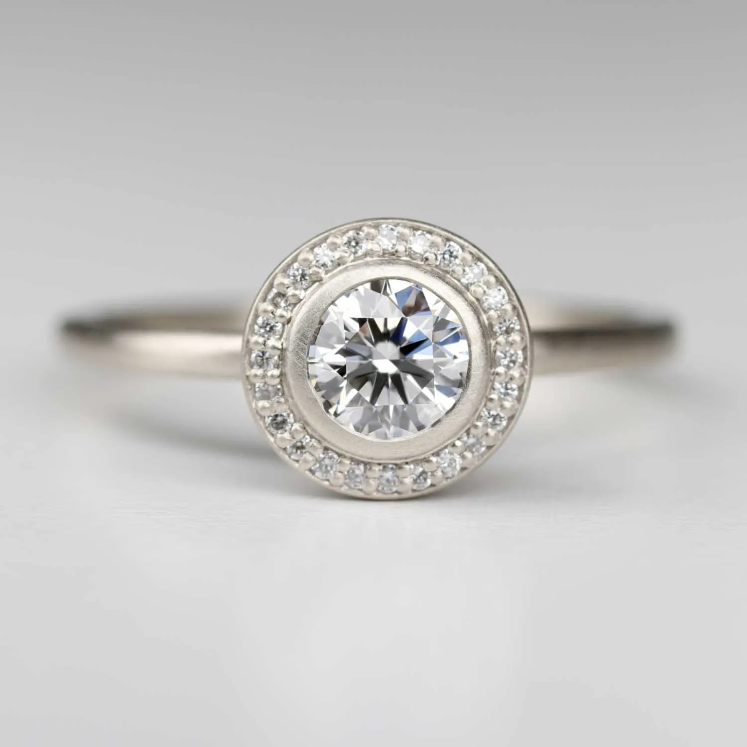 Bezel-set Halo Solitaire Engagement Ring