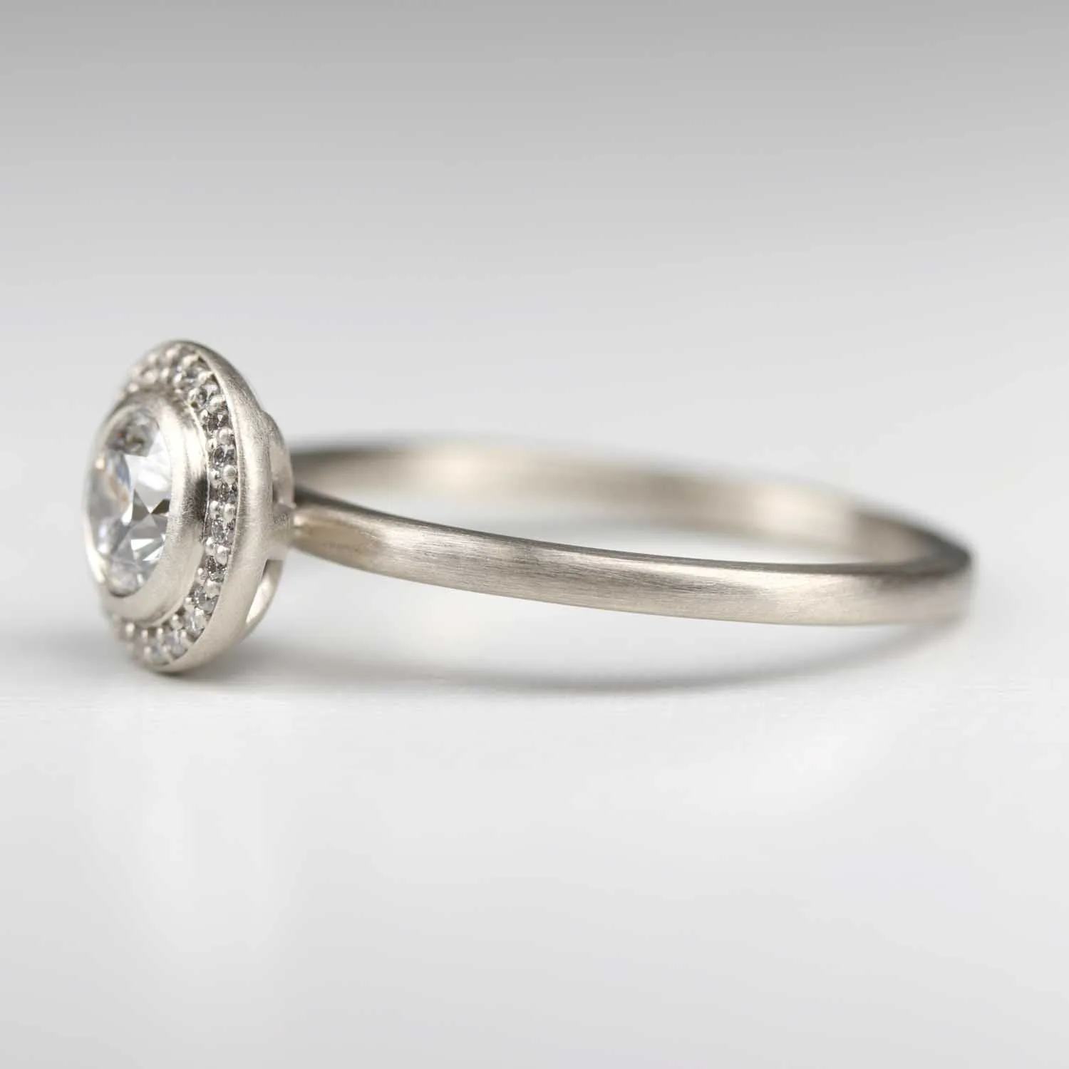 Bezel-set Halo Solitaire Engagement Ring