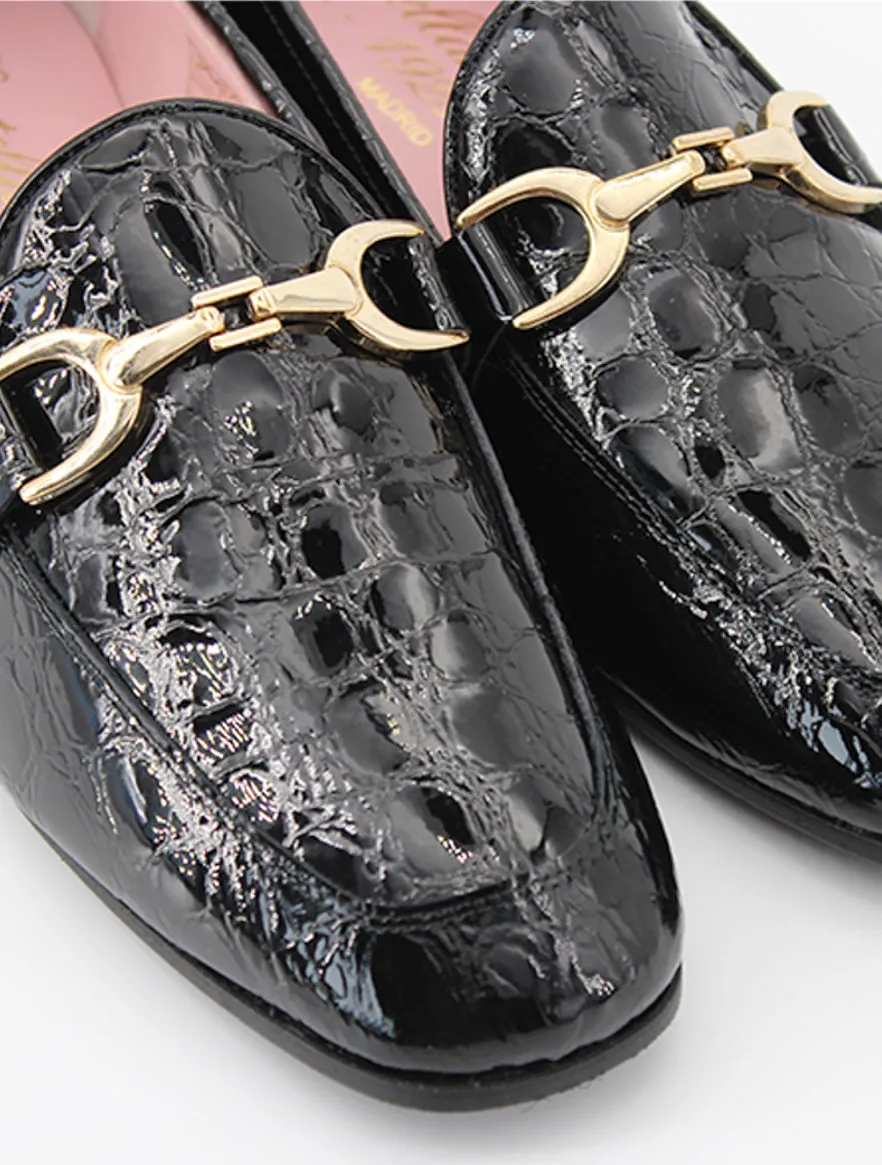 Black patent leather Giverny loafers.