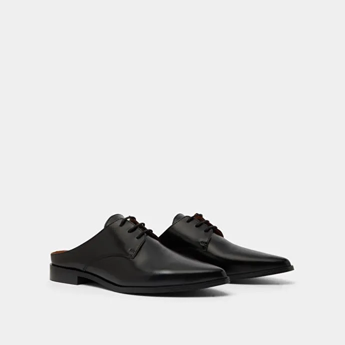 Mules with laces in black glazed leather