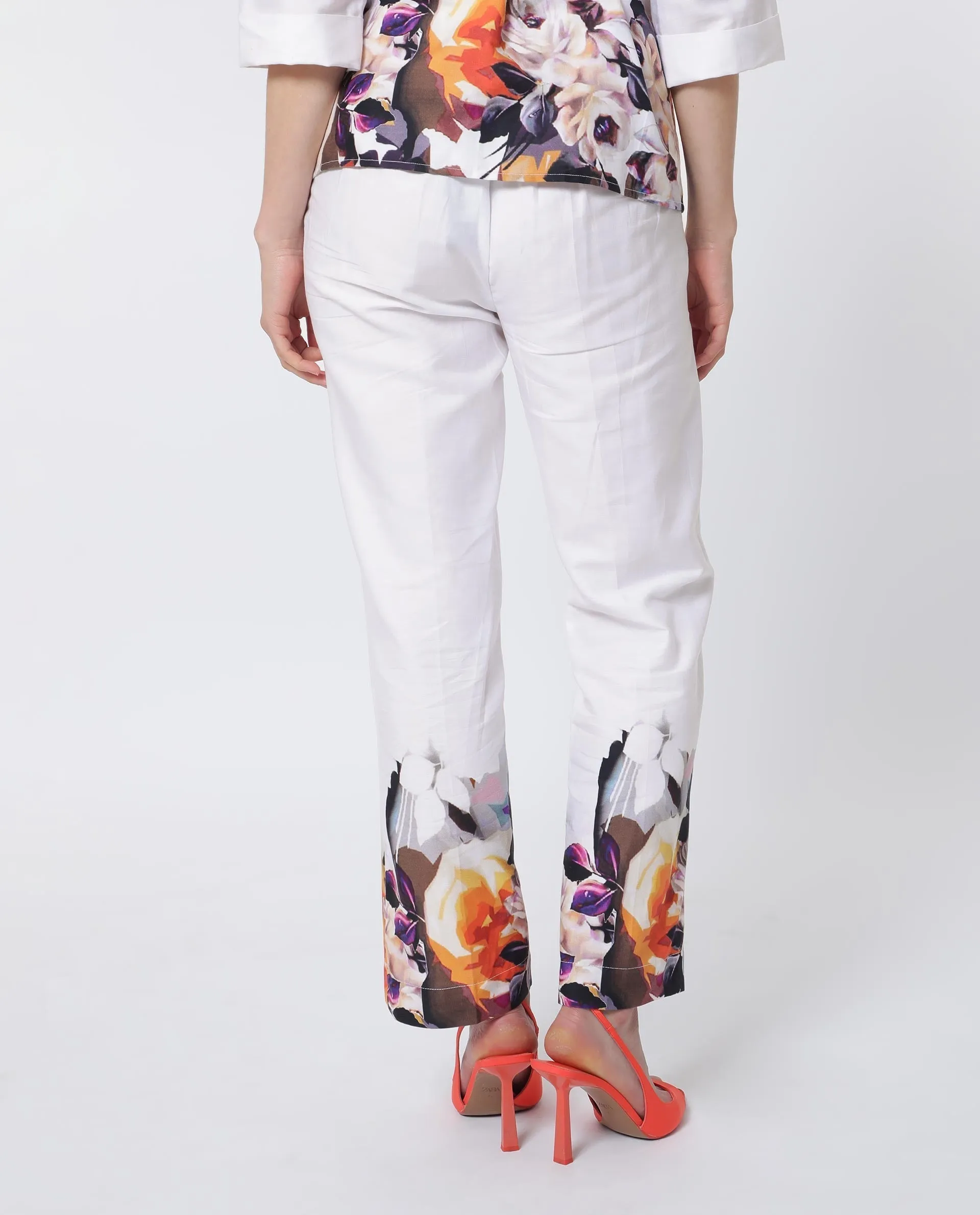 Rareism Women Weigen White Cotton Fabric Relaxed Fit Floral Print Ankle Length Trousers