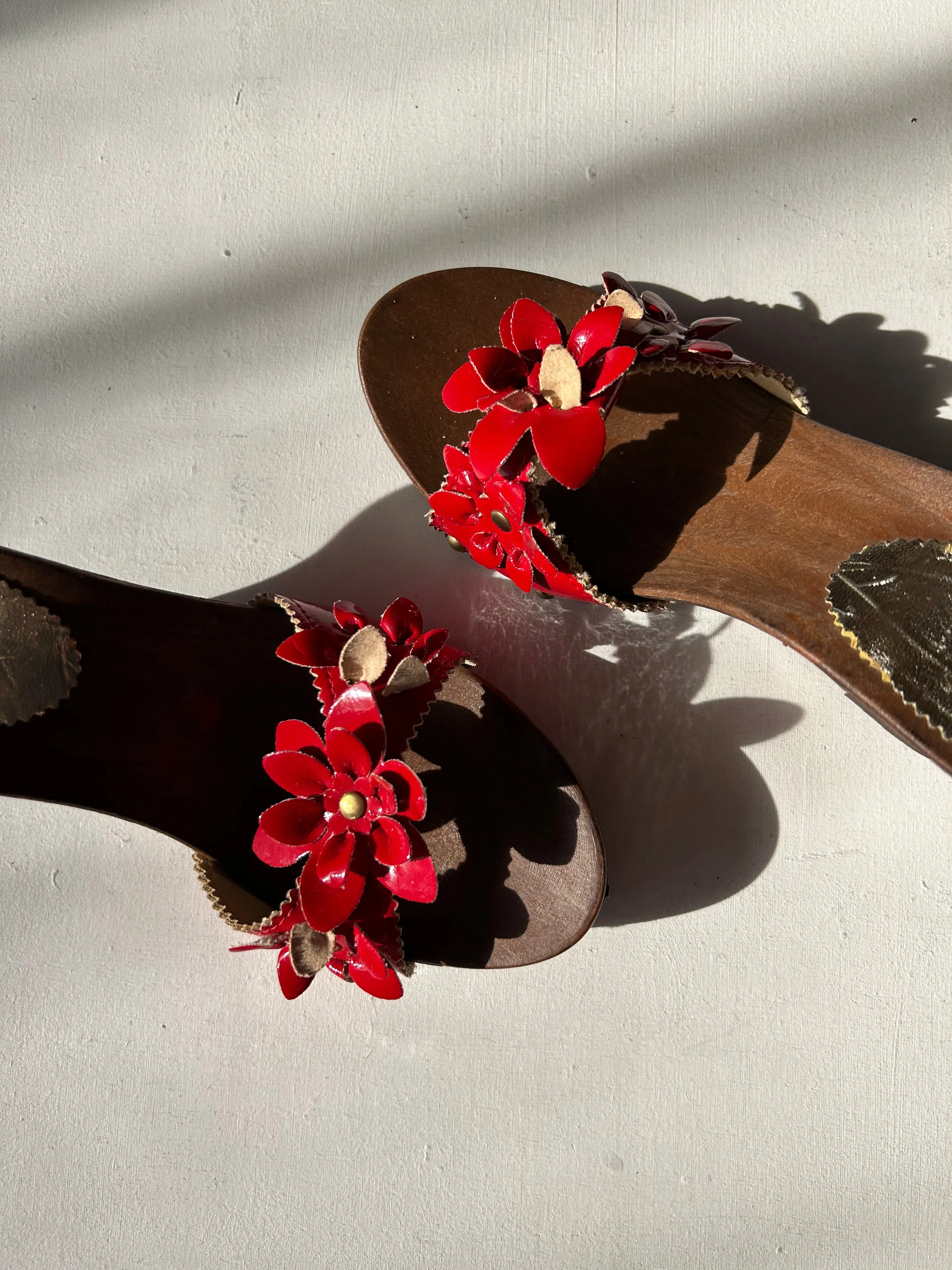 red flowers appliquée mules on wooden platforms in size 37